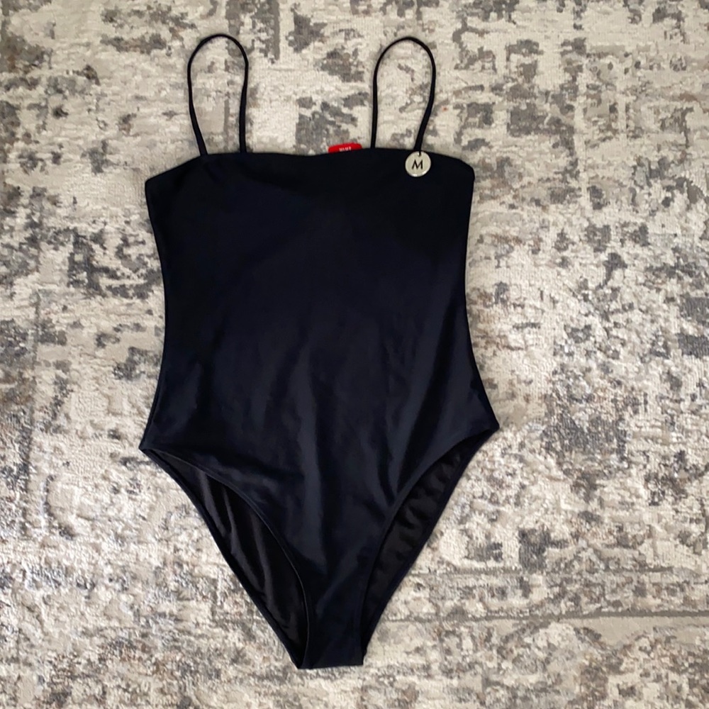 NWT’s sleek black one piece bathing suit
